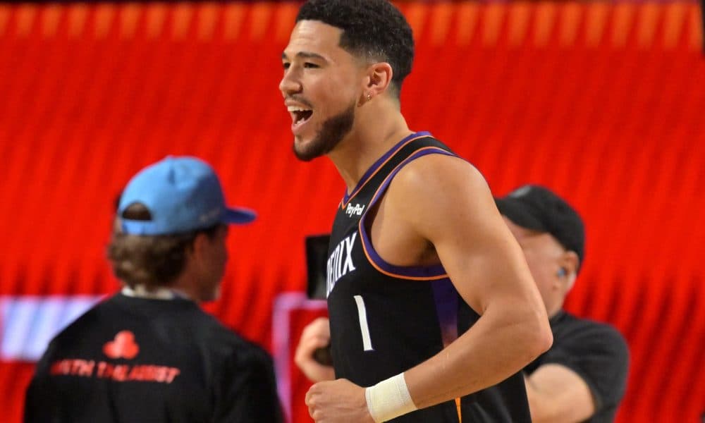 J. Cole Celebrates Suns Star Devin Booker at Phoenix Pop-Up Event