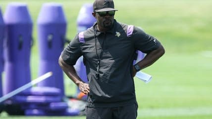 Vikings DC Brian Flores Returns to Lead Defense Amid Team Challenges
